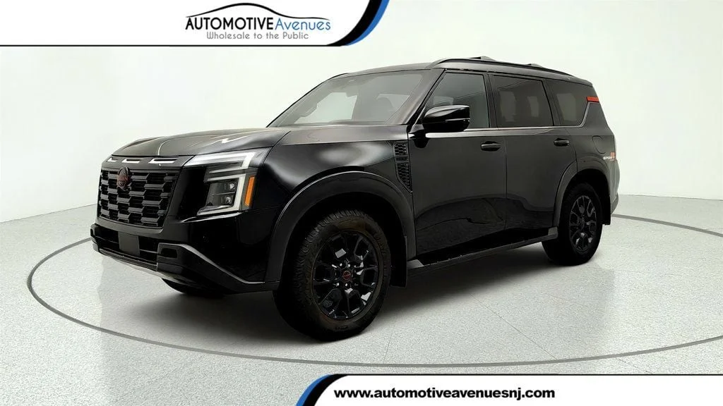 Used 2025 Super Black Nissan 4x4 PRO-4X w/ Cross Bars image 1