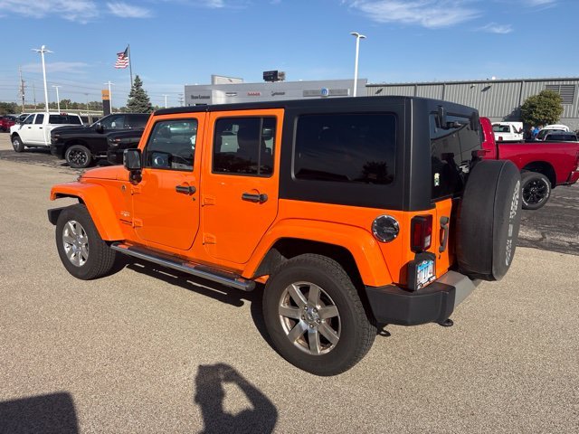 Used 2012 Orange Jeep Unlimited Sahara image 5