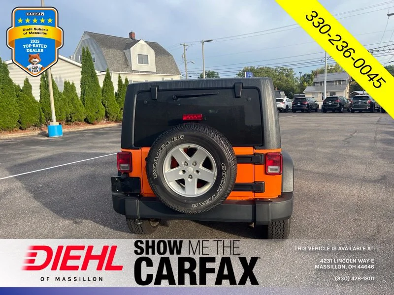Used 2013 Orange Jeep Unlimited Sport image 3