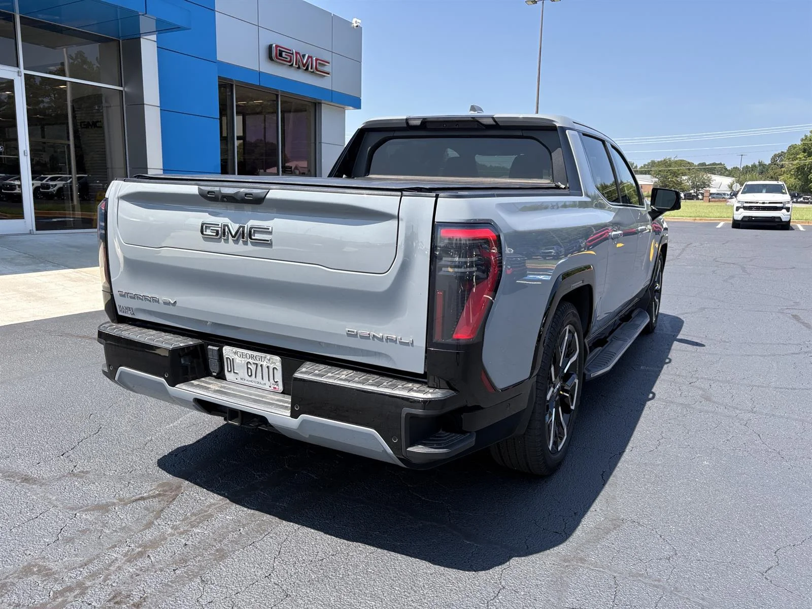 Used 2025 Thunderstorm Gray GMC Max Range Denali image 5