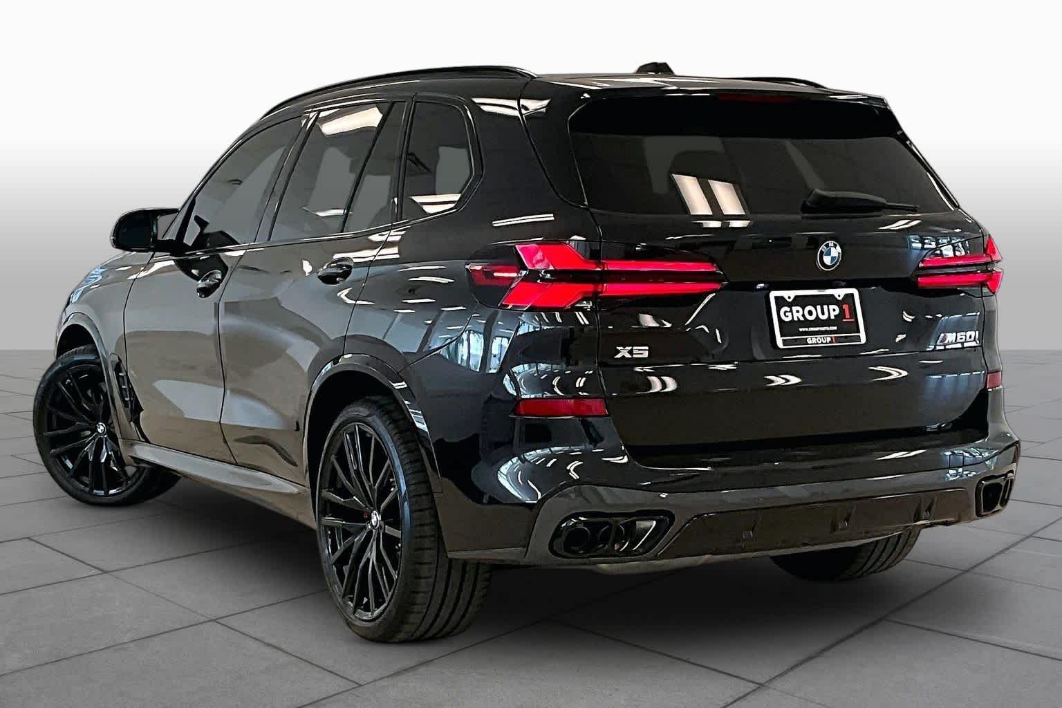 Used 2026 Black Sapphire Metallic BMW M60i image 11