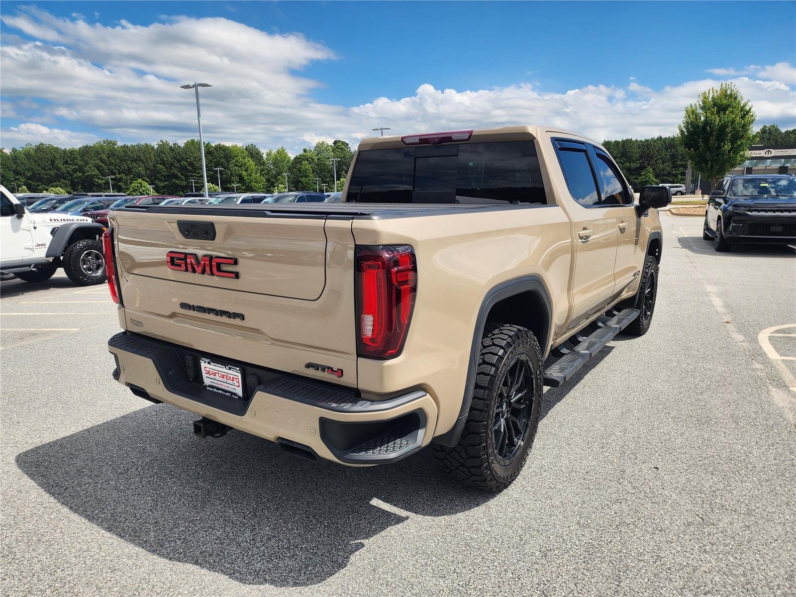 Used 2023 Desert Sand Metallic GMC AT4 image 6