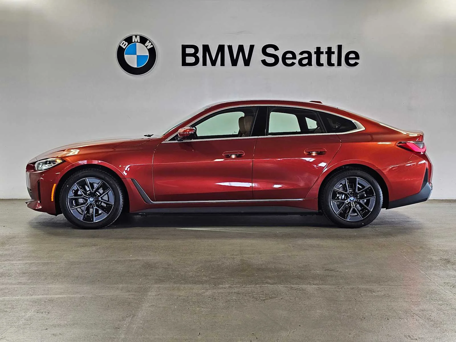Certified Used 2023 Sunset Orange Metallic BMW eDrive35 image 3