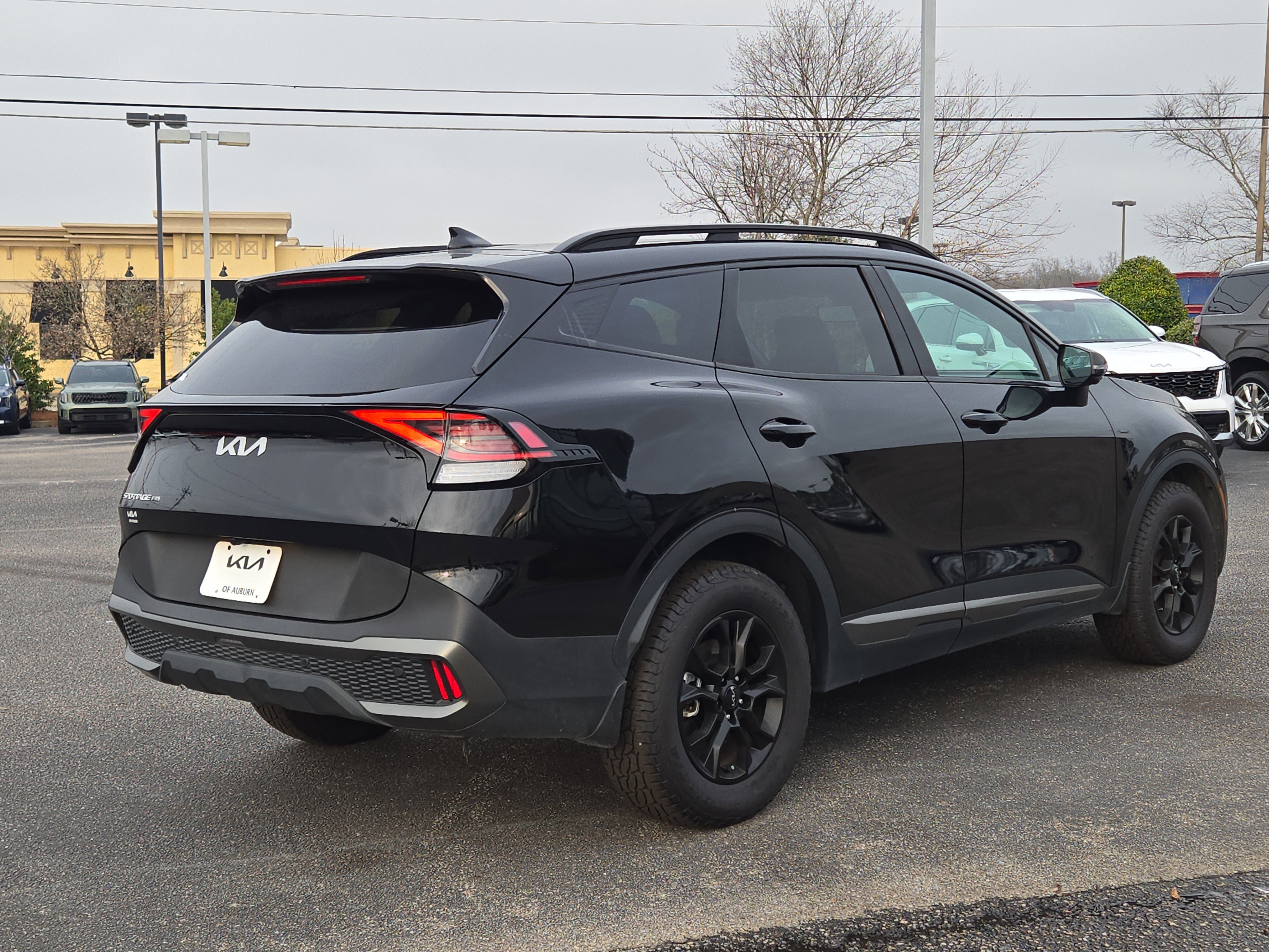 Used 2024 Ebony Black Kia X-Pro Prestige image 6