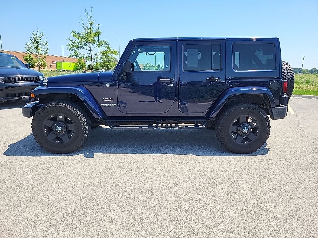 Used 2013 Blue Jeep Unlimited Sahara image 2