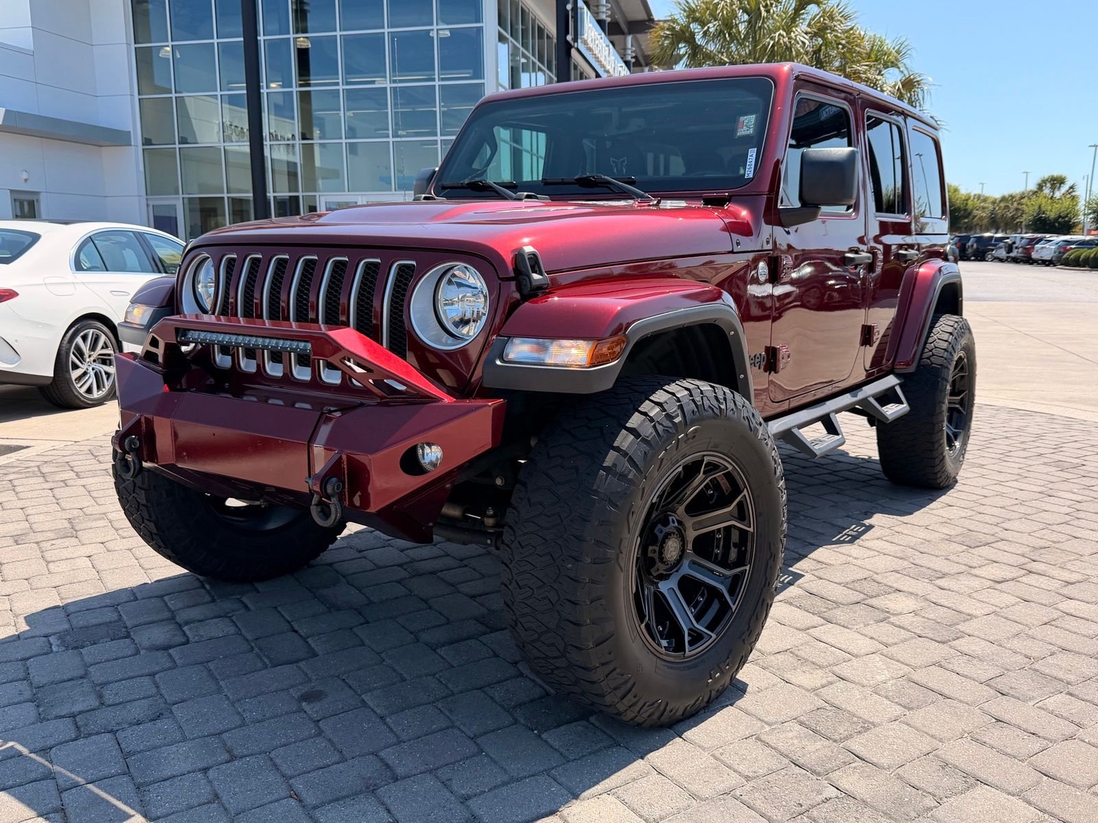 Used 2022 Snazzberry Pearlcoat Jeep Unlimited Sahara image 1