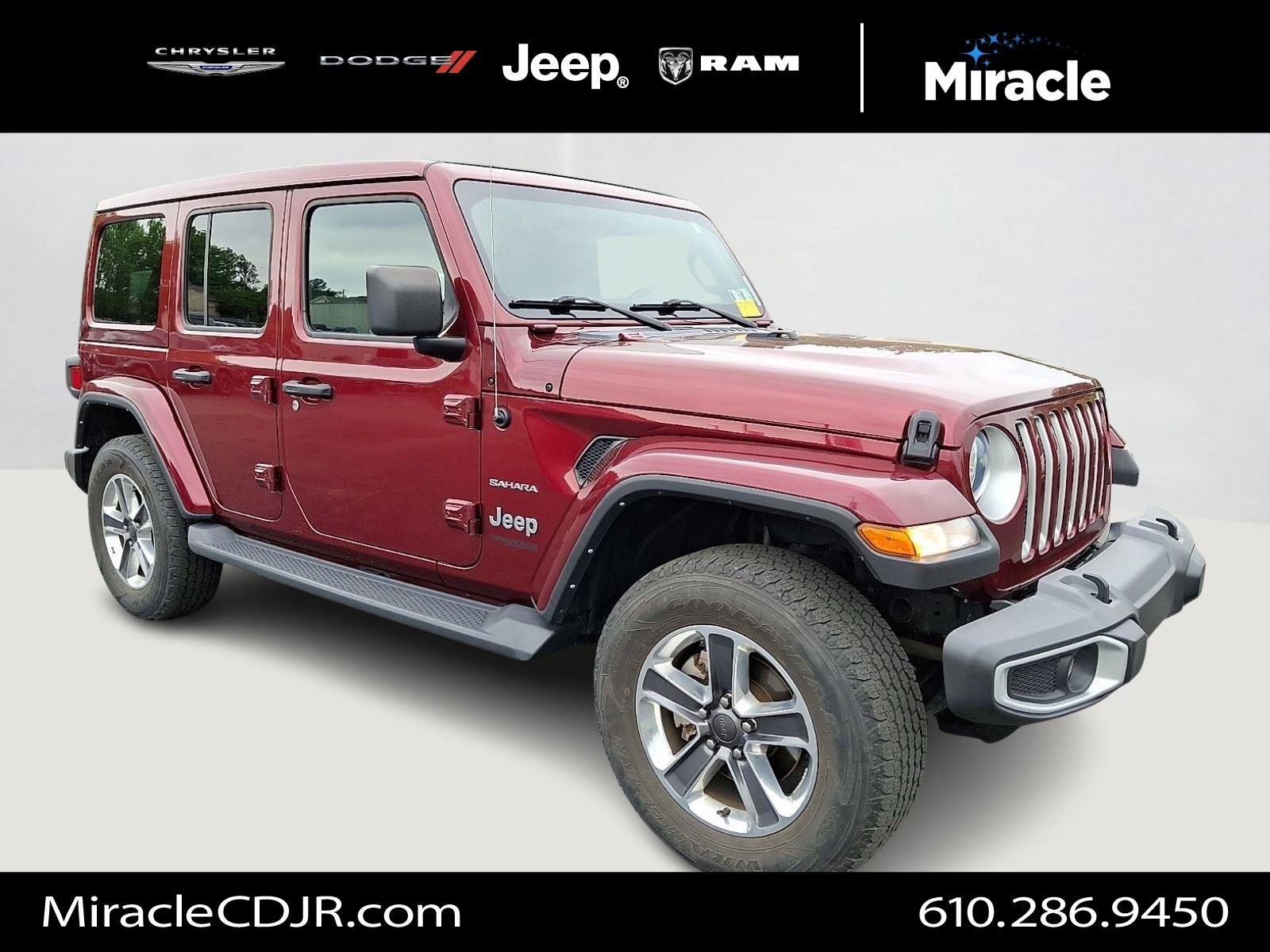 Used 2021 Snazzberry Pearlcoat Jeep Unlimited Sahara image 1