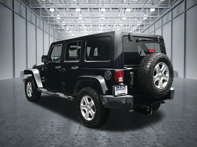 Used 2017 Black Jeep Unlimited Sahara image 4