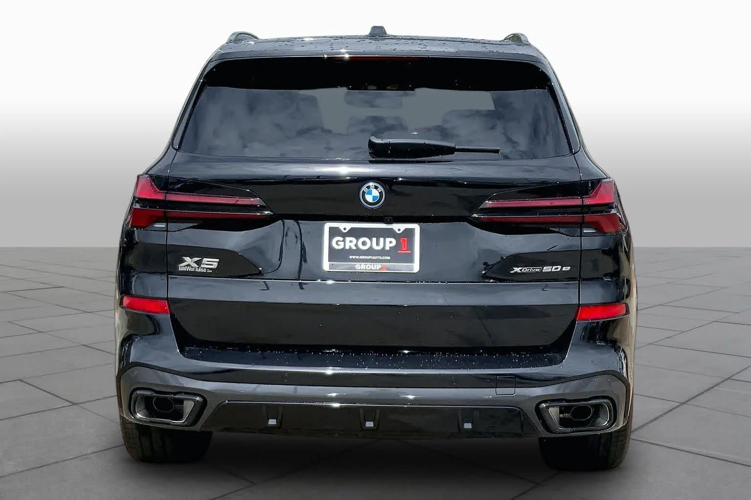 New 2026 Black Sapphire Metallic BMW xDrive50e image 4