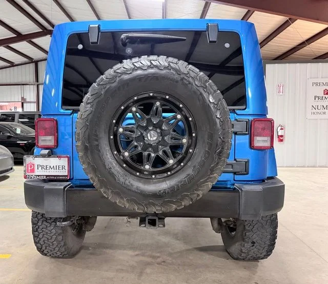 Used 2014 Blue Jeep Unlimited Sahara image 4