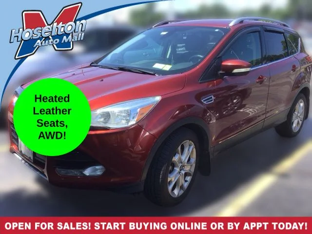 Used 2014 Orange Ford Titanium image 1