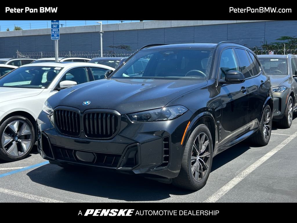 Certified Used 2024 Black Sapphire Metallic BMW xDrive50e image 1