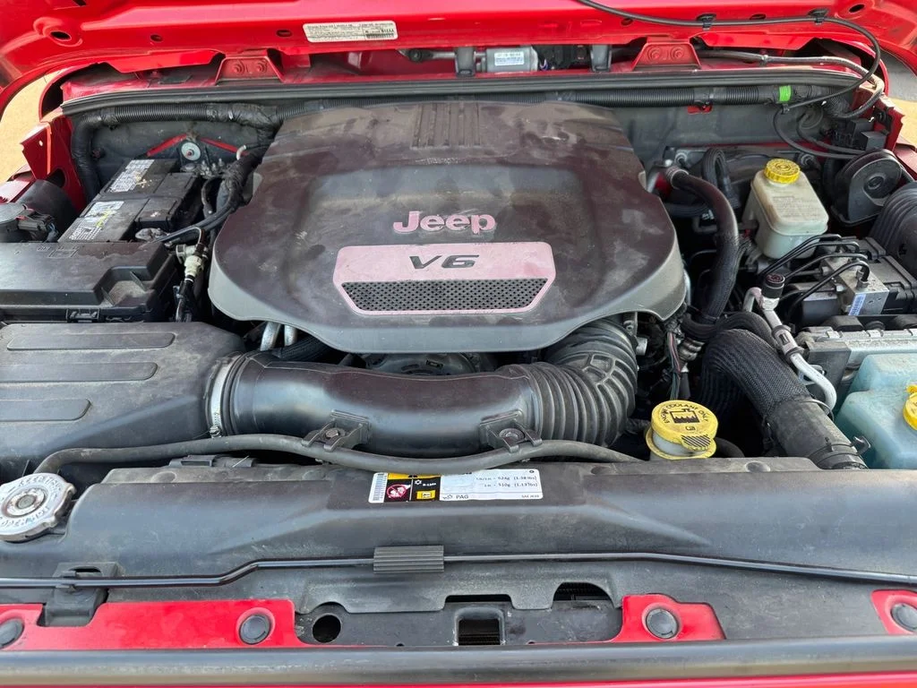 Used 2014 Red Jeep Unlimited Sport image 14