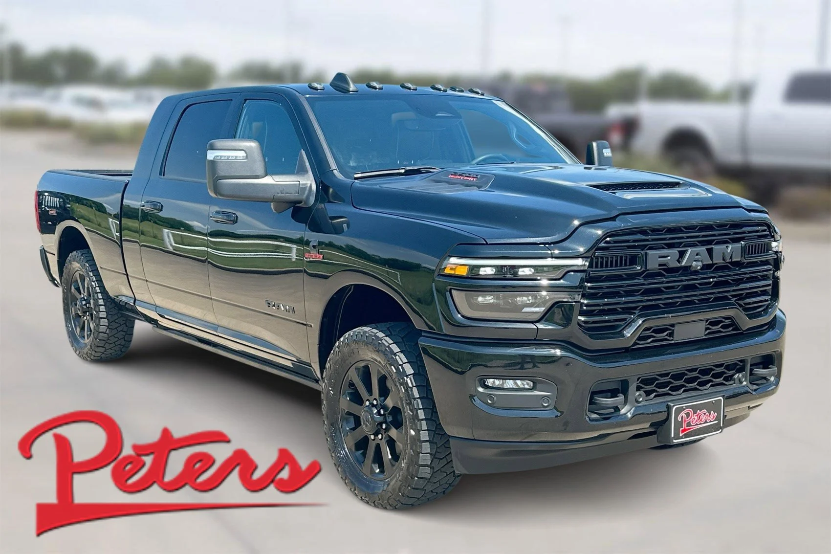 Used 2025 Diamond Black Crystal Pearlcoat Ram Laramie image 1