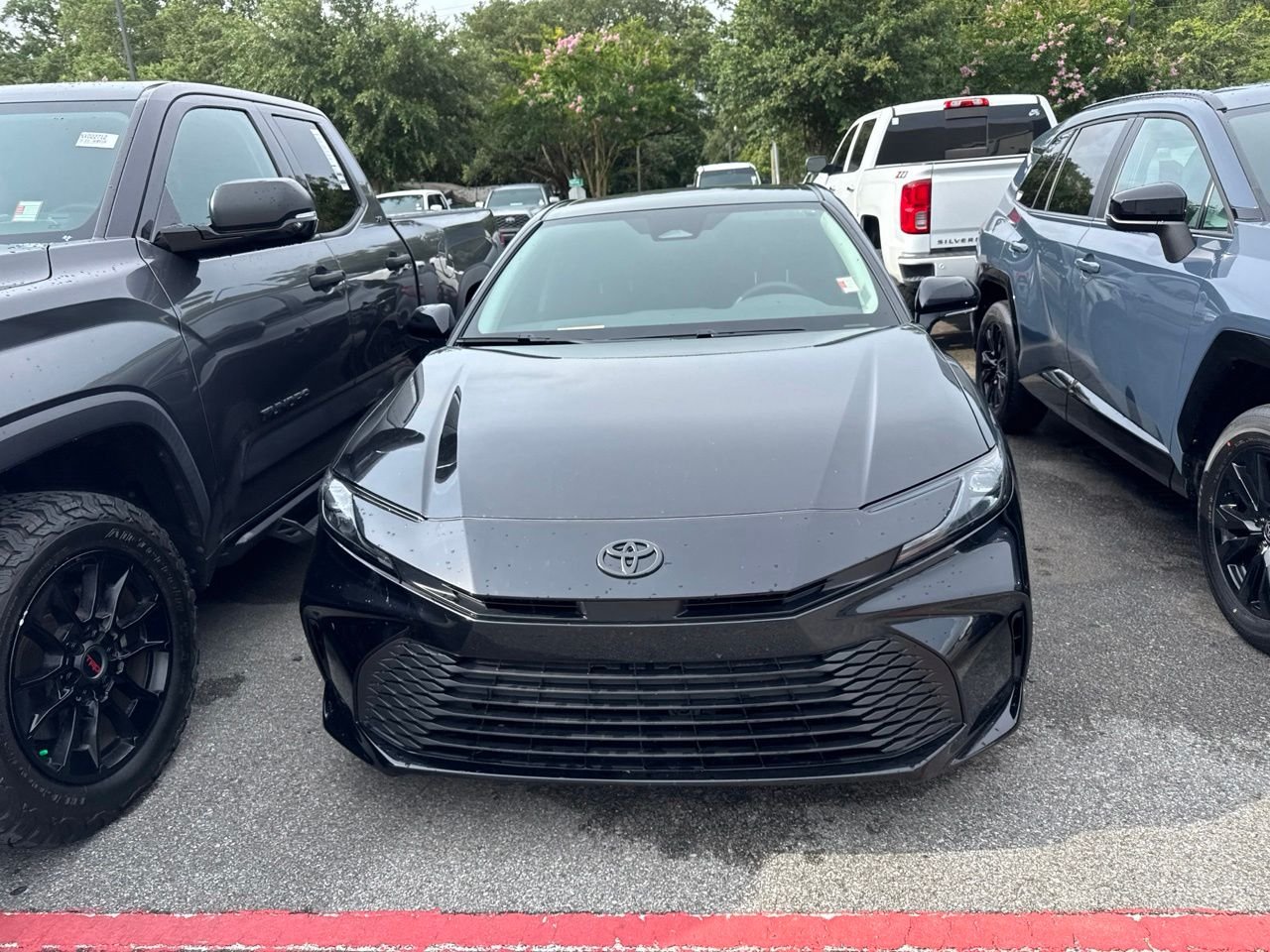 Used 2025 Black Toyota LE image 2