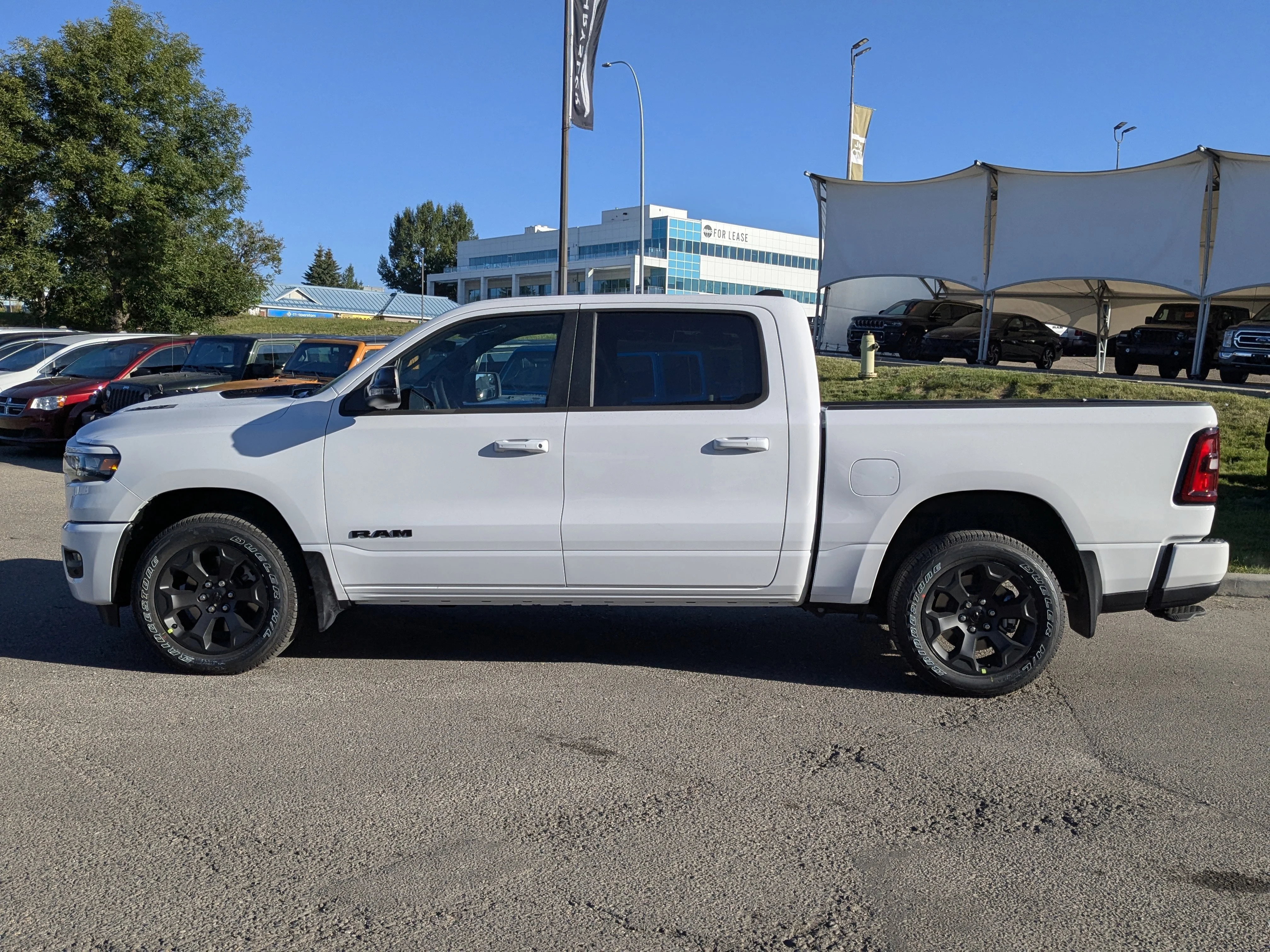 New 2026 White RAM Sport - 3.92 Rear Axle Ratio - Anti Spin Rear Diff - Sport Hood - Panoramic Sunroof & Tons More! image 4