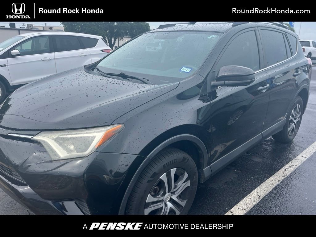 Used 2016 Black Toyota LE image 1