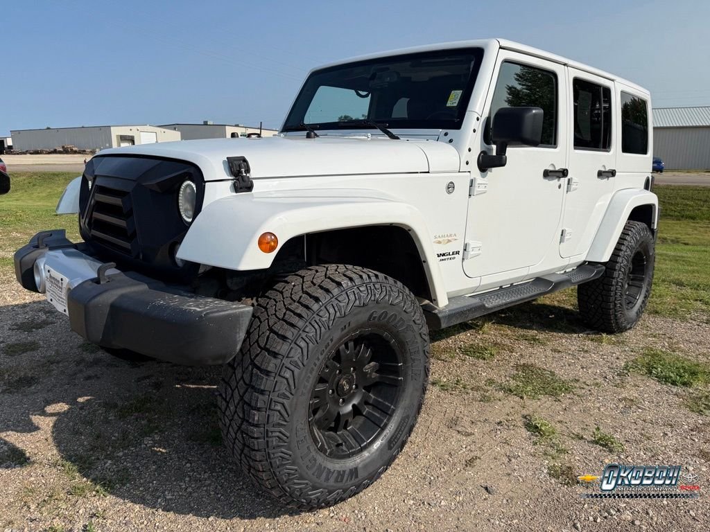 Used 2015 White Jeep Unlimited Sahara image 7
