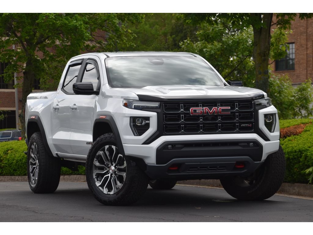 Used 2024 Summit White GMC 4WD AT4 image 1