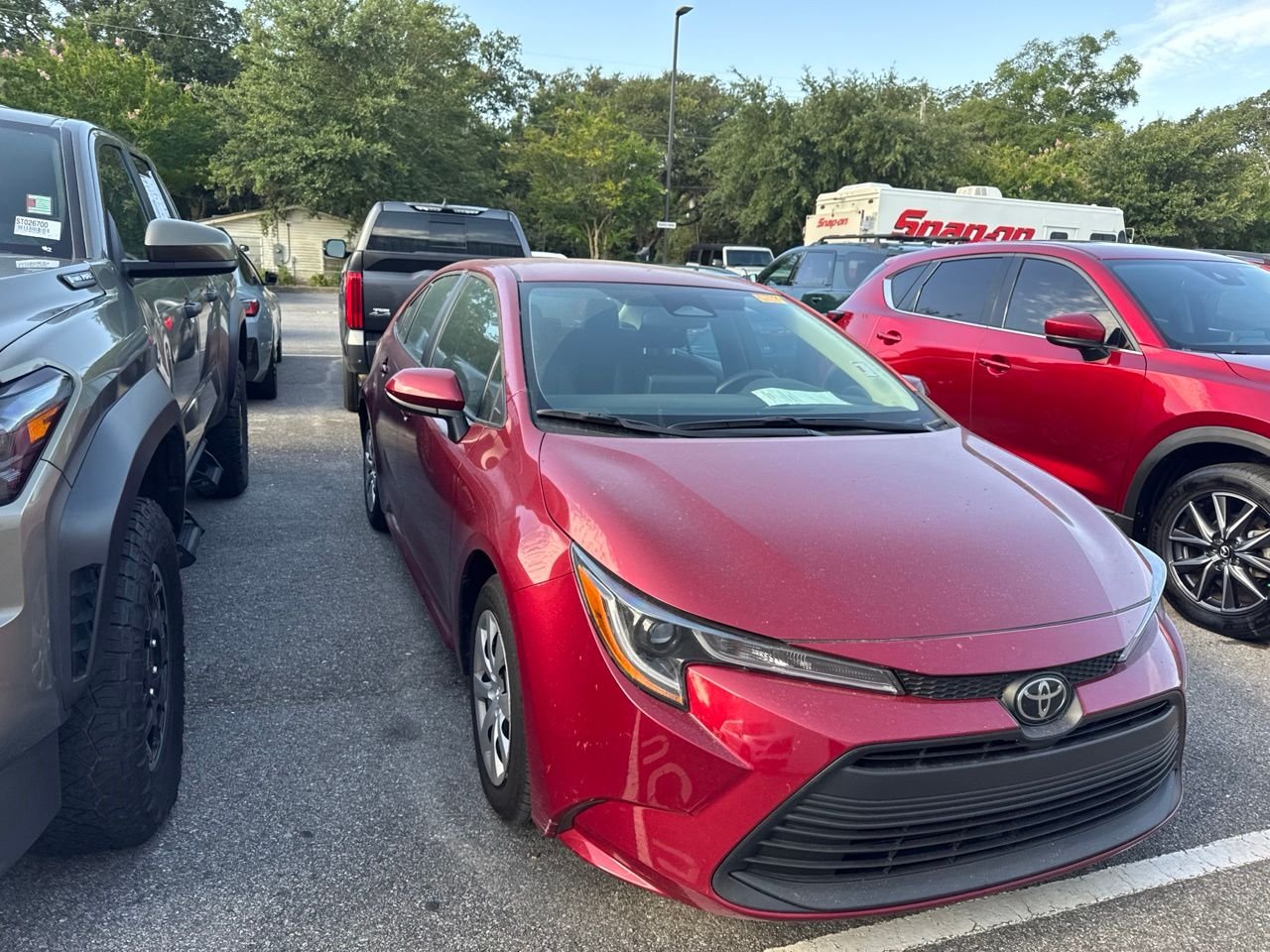 Used 2024 Red Toyota LE image 3