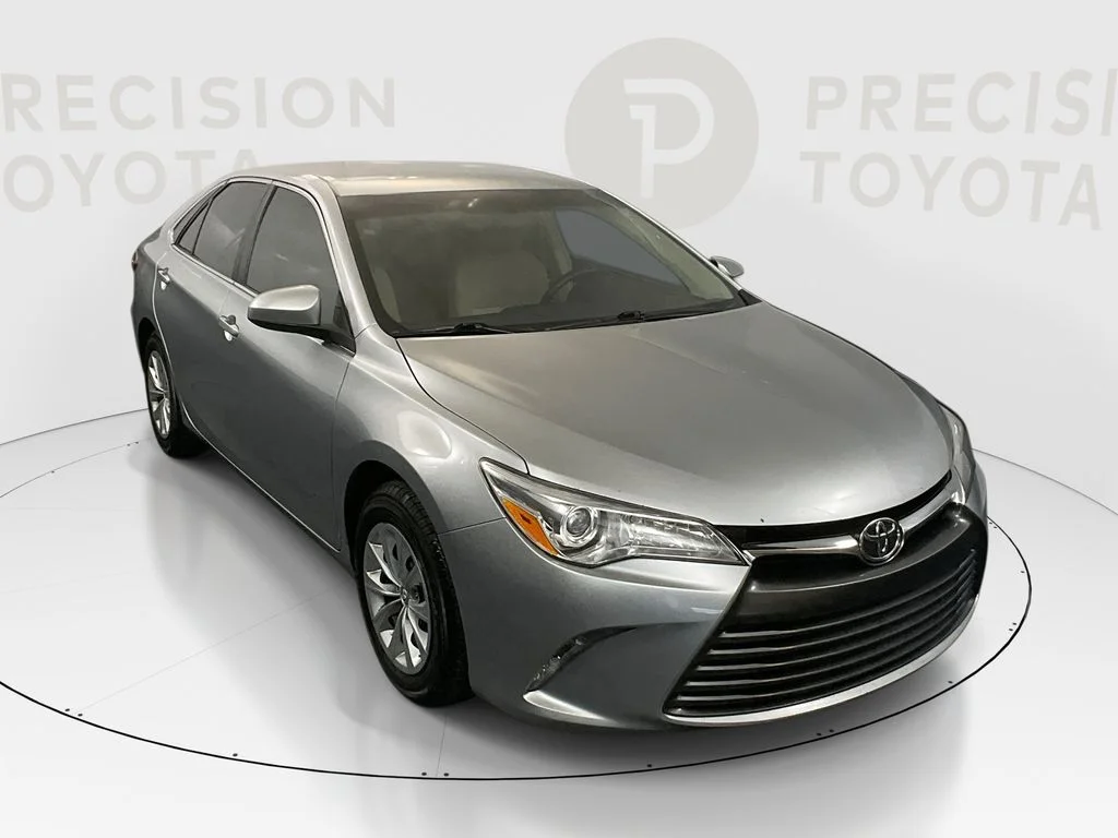 Used 2016 Celestial Silver Metallic Toyota LE image 1