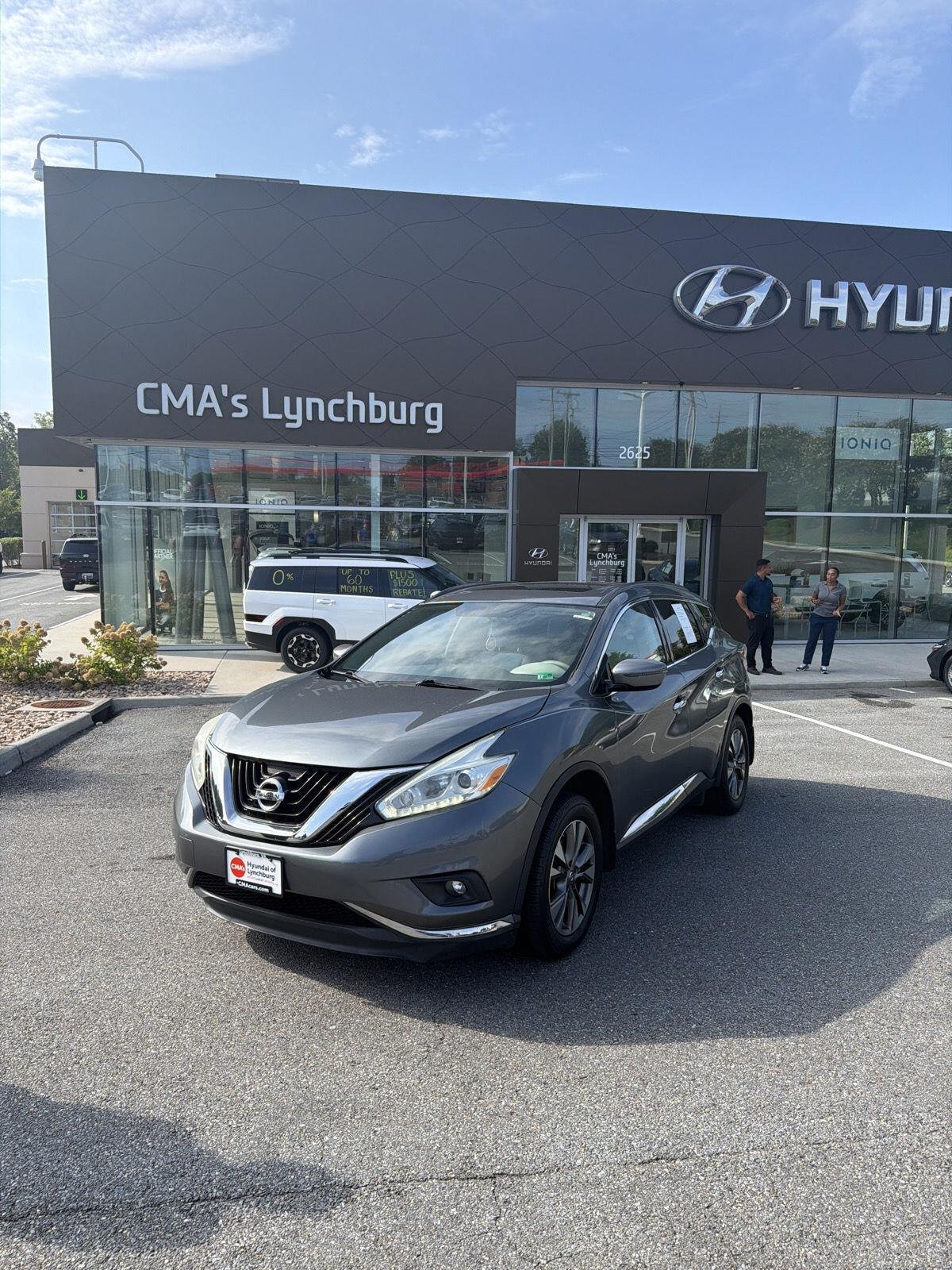 Used 2016 Gun Metallic Nissan SV image 2
