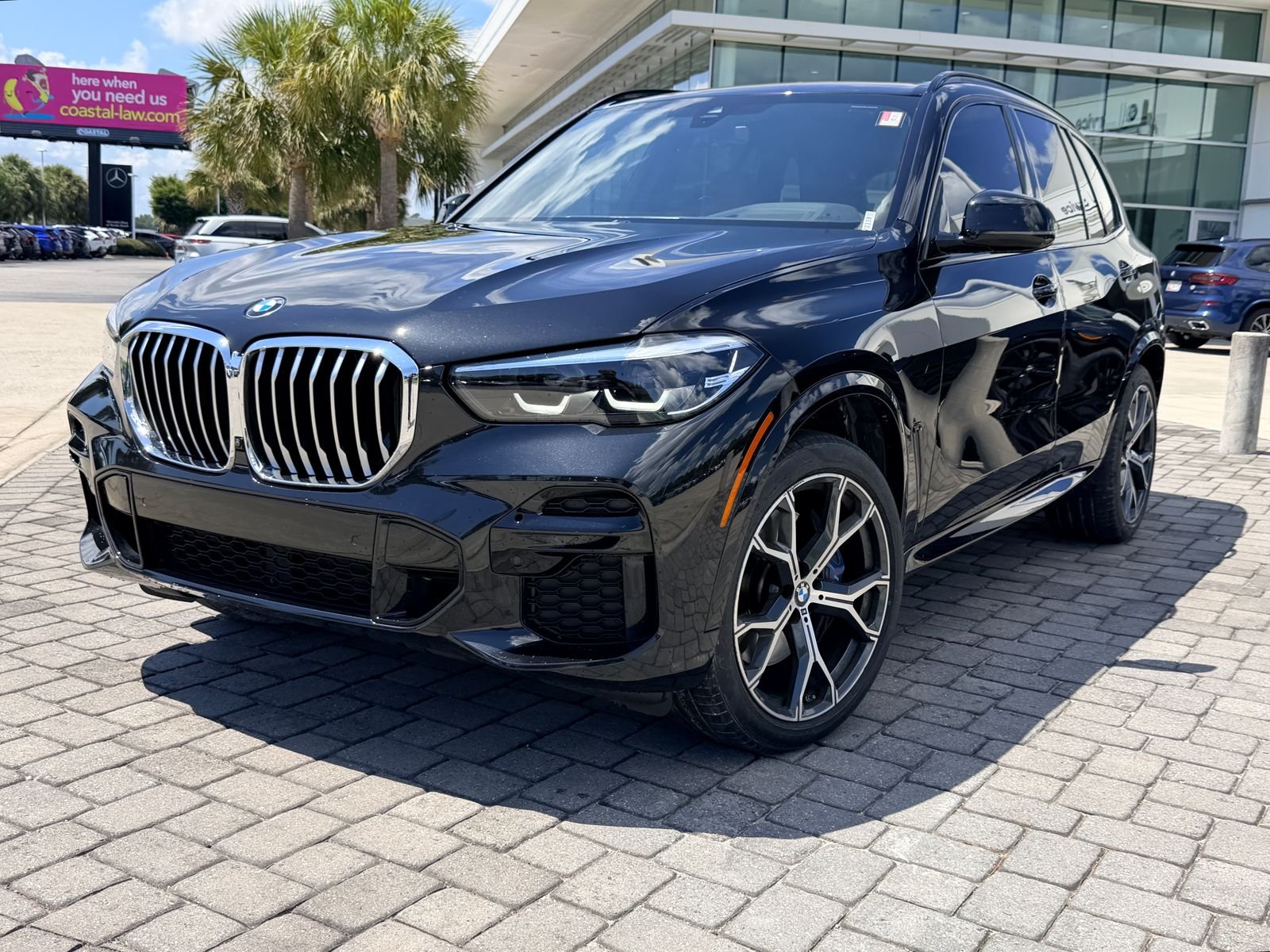 Certified Used 2023 Black Sapphire Metallic BMW xDrive40i image 1