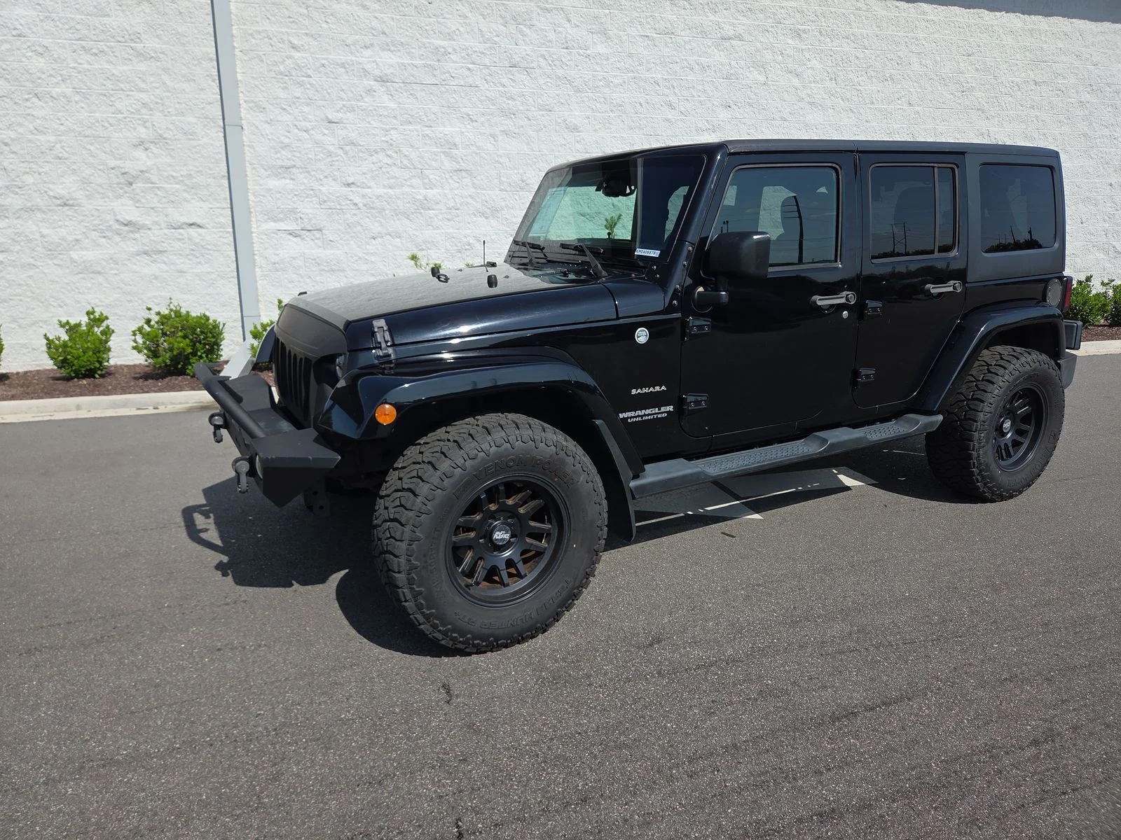Used 2016 Black Clearcoat Jeep Unlimited Sahara image 1