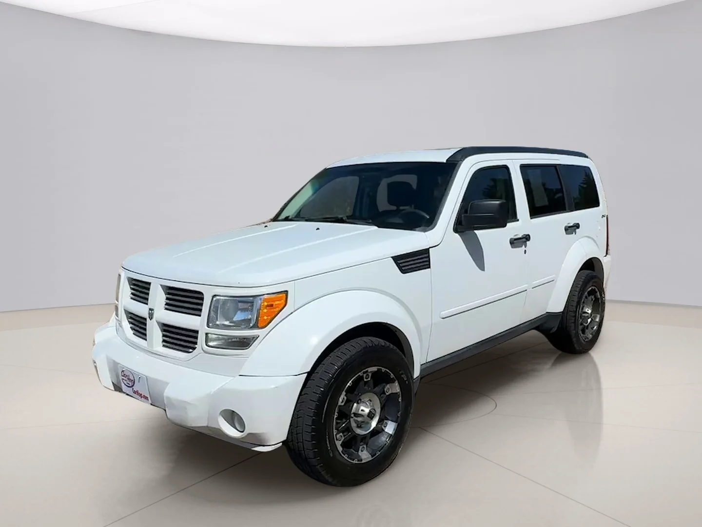 Used 2011 White Dodge HEAT 4WD image 1