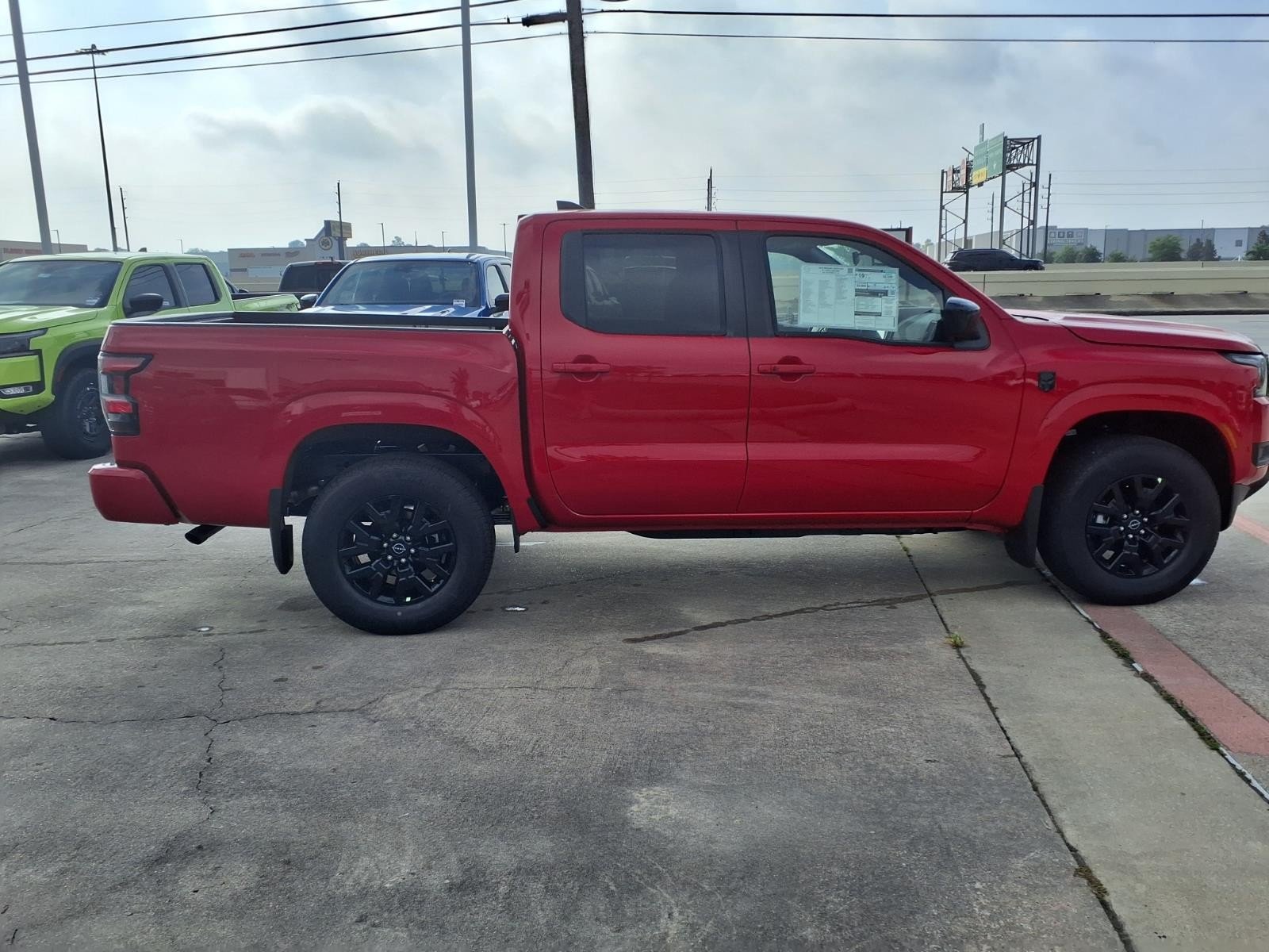 2026 Nissan Frontier SV Red at Robbins Nissan
