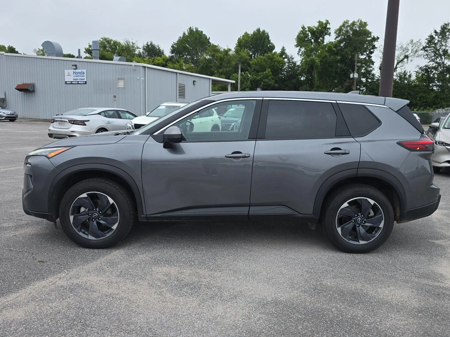 Used 2024 Gun Metallic Nissan SV image 2