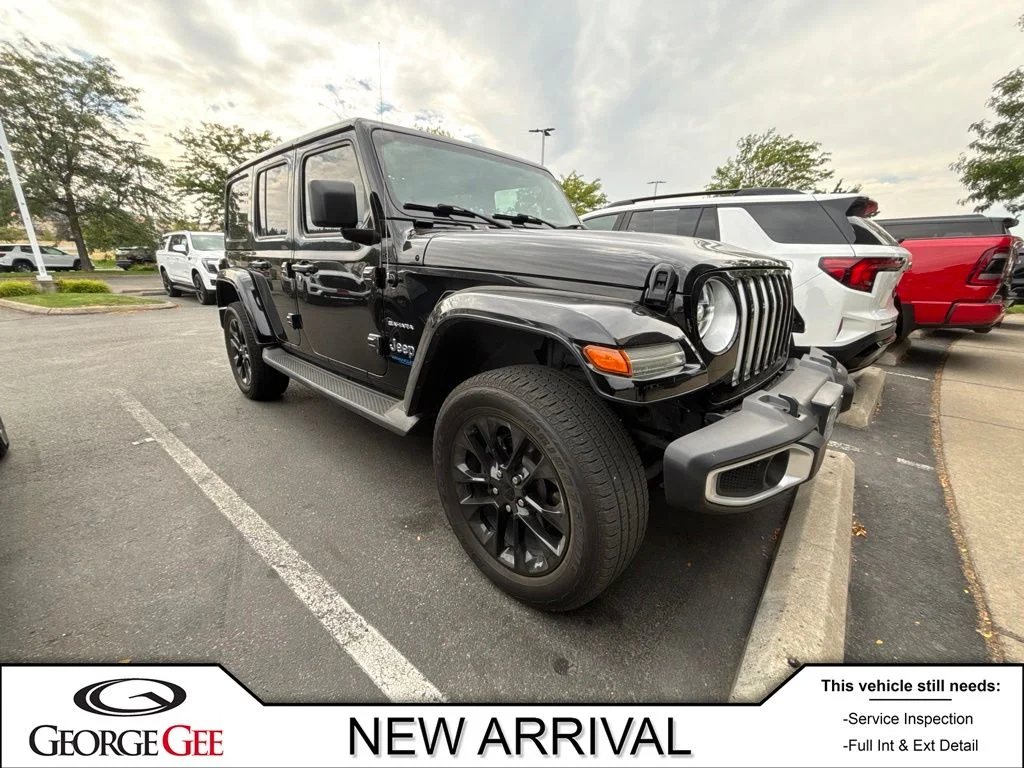 Used 2021 Black Jeep Unlimited Sahara 4xe image 1