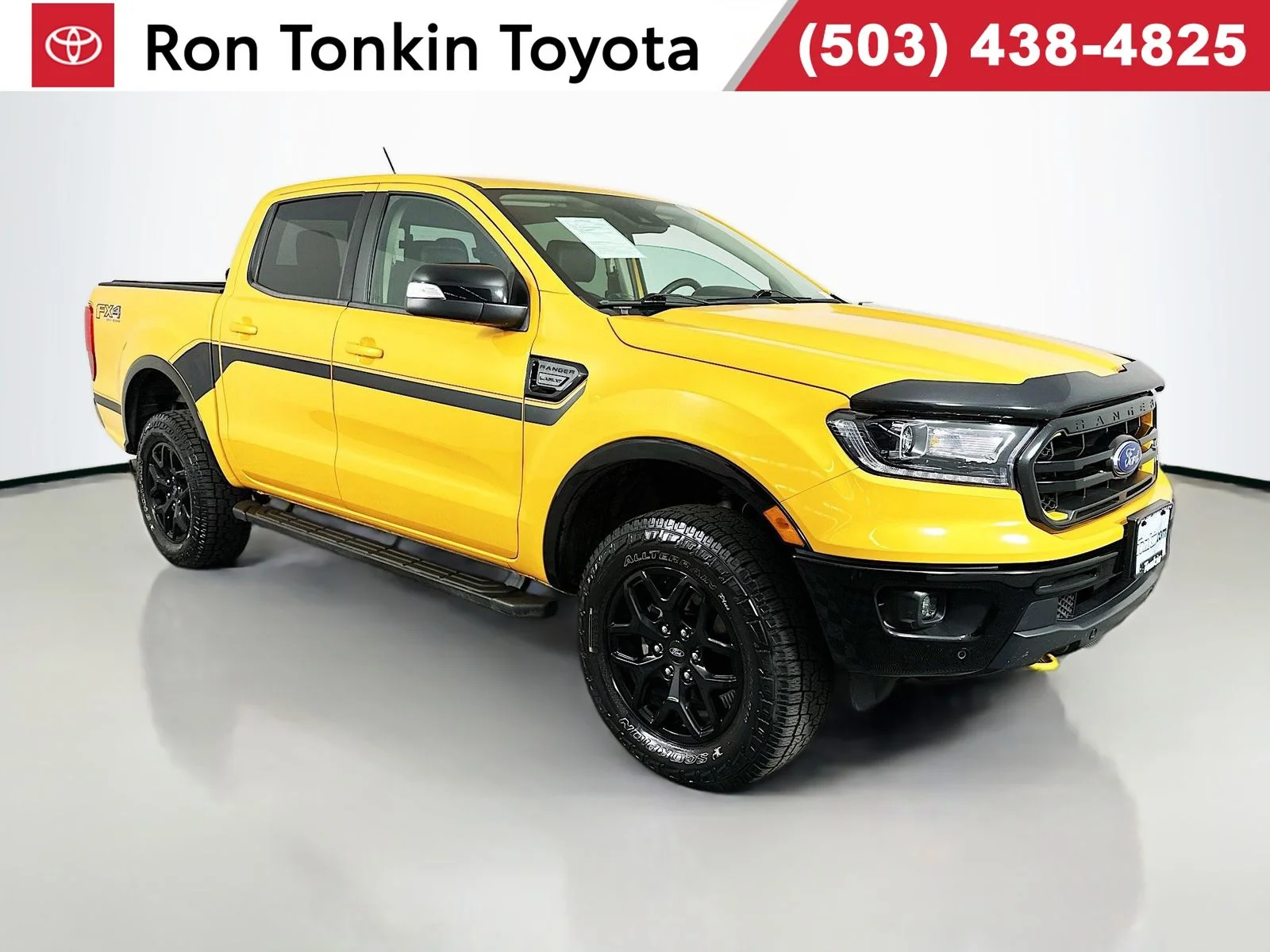 Used 2022 Orange Ford Lariat image 1