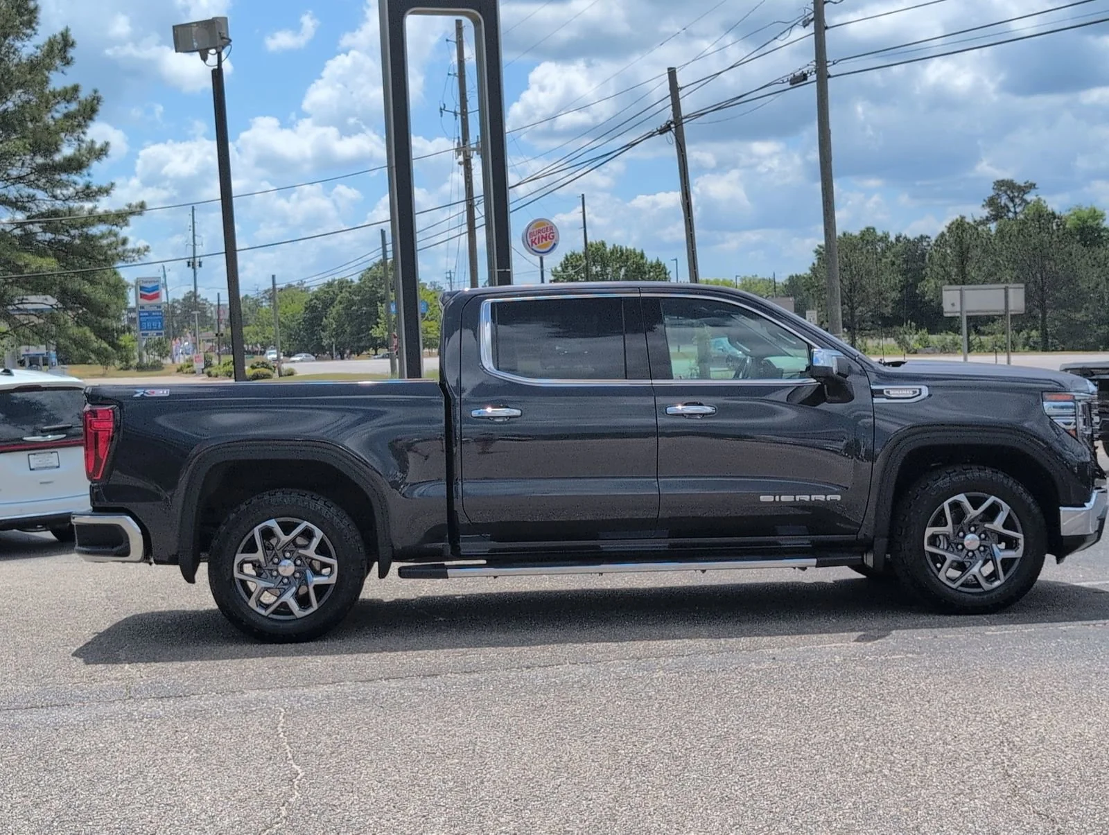 Used 2023 Titanium Rush Metallic GMC SLT image 7