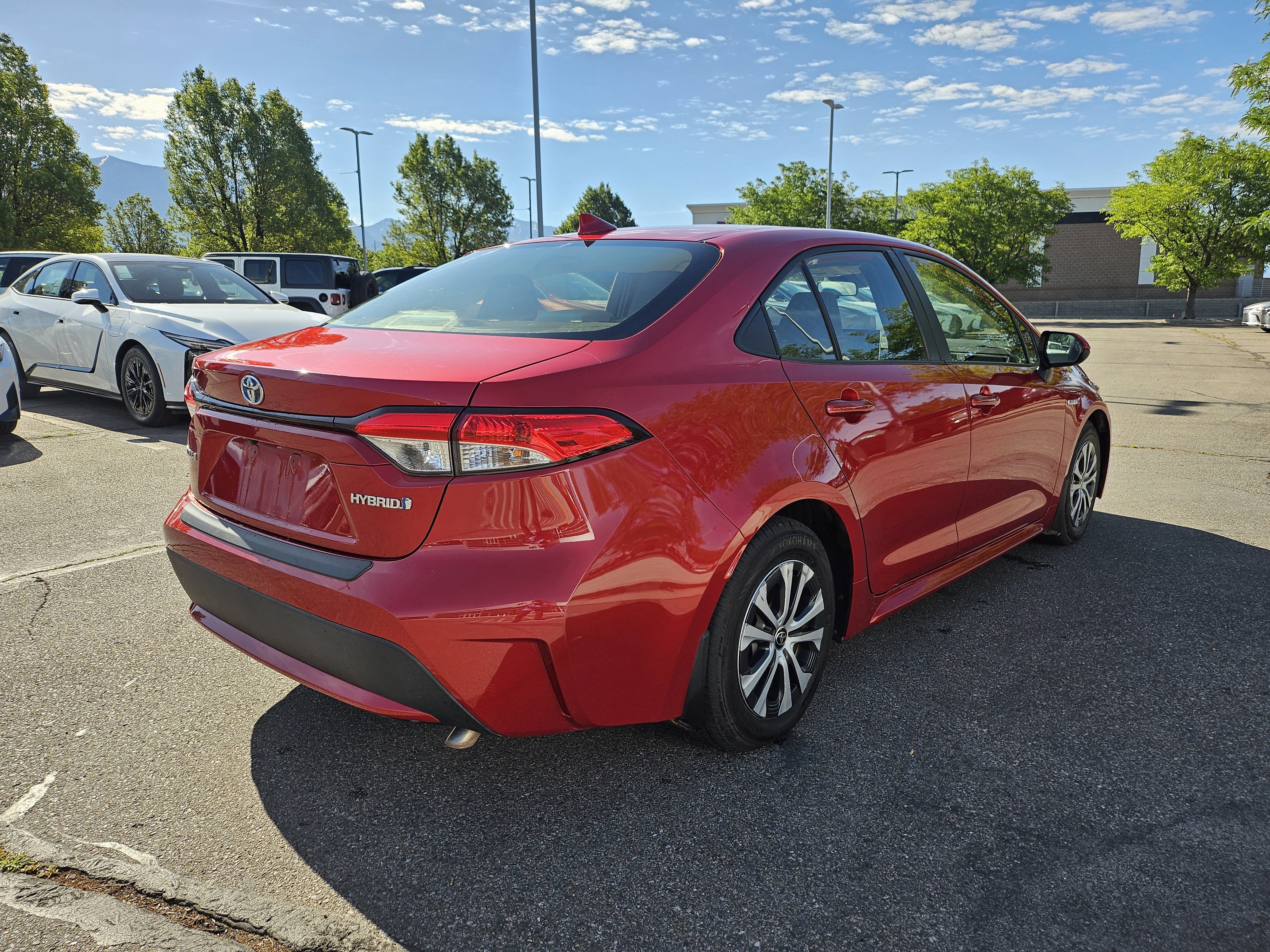 Used 2021 Barcelona Red Metallic Toyota LE image 5