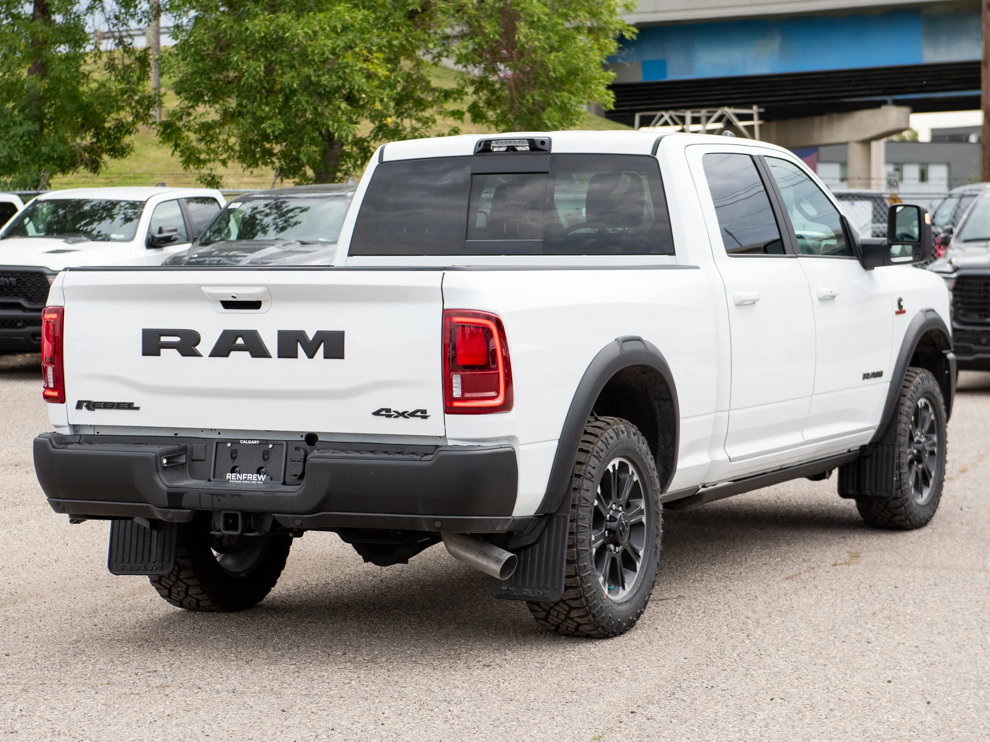 New 2026 White RAM Rebel* Crew Cab 4x4, 6.7L Cummins, Sunroof, 34 Inch A/T Tires, Passenger Screen image 9