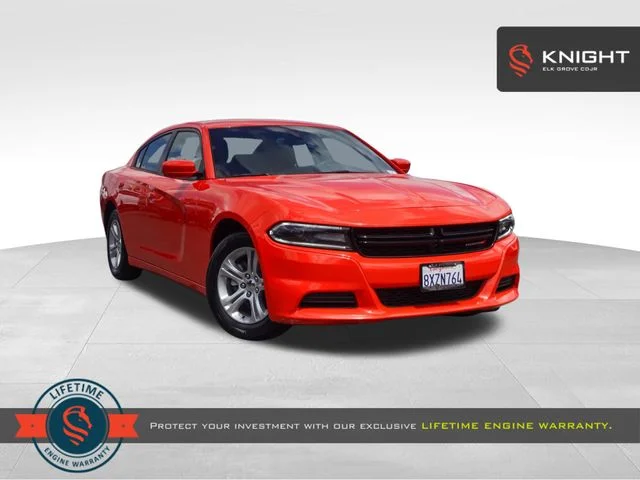 Used 2021 Orange Dodge SXT image 1