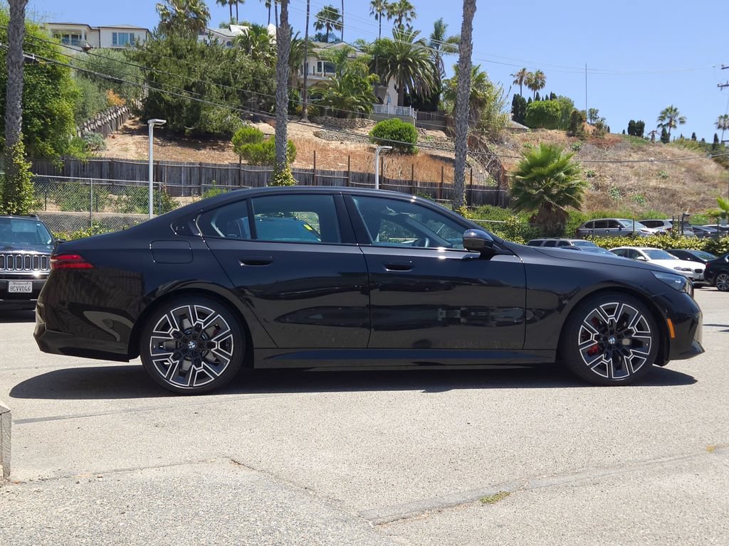 Used 2026 Black Sapphire Metallic BMW 550e xDrive image 4