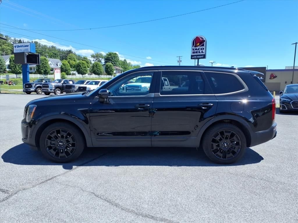 Used 2022 Ebony Black Kia EX image 2
