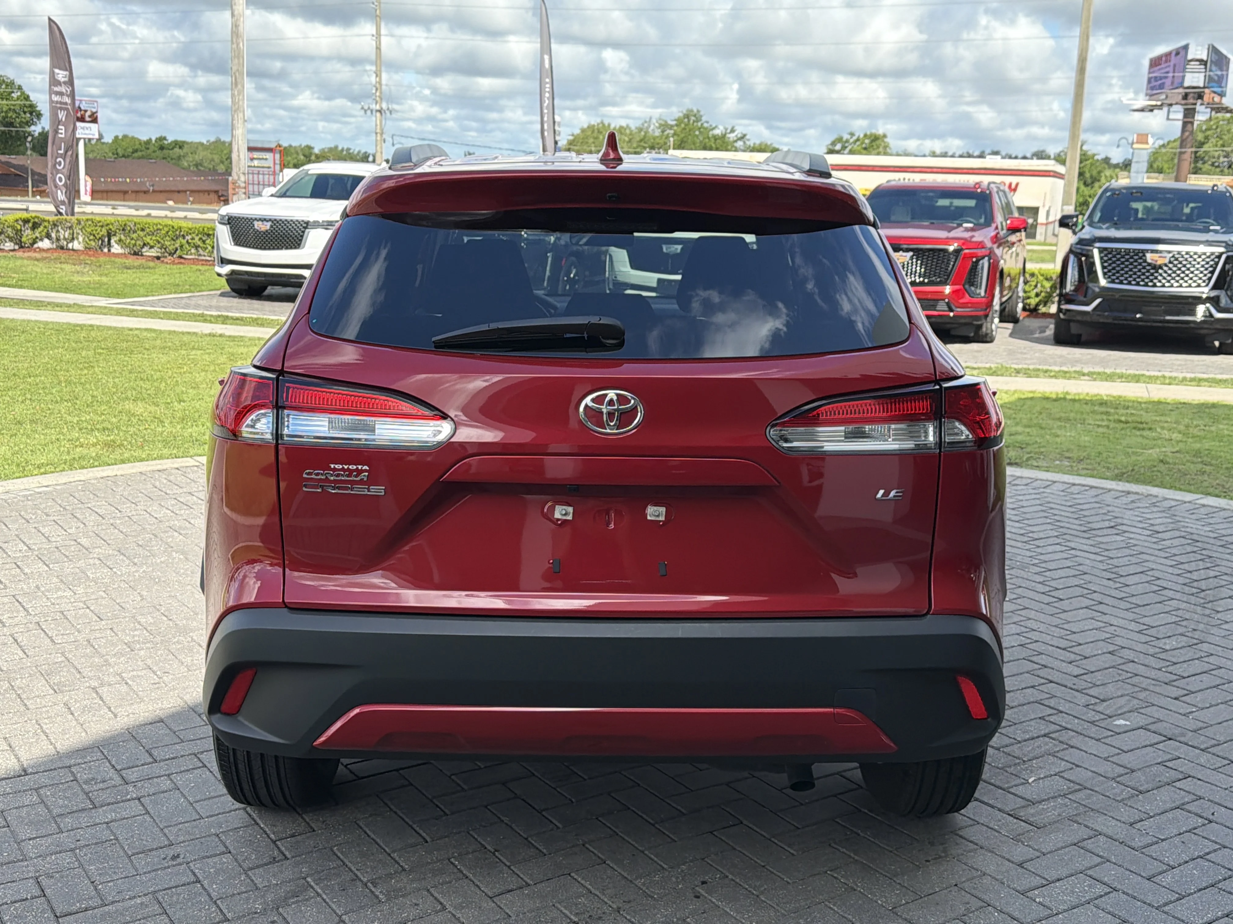 Used 2023 Barcelona Red Metallic Toyota LE image 5