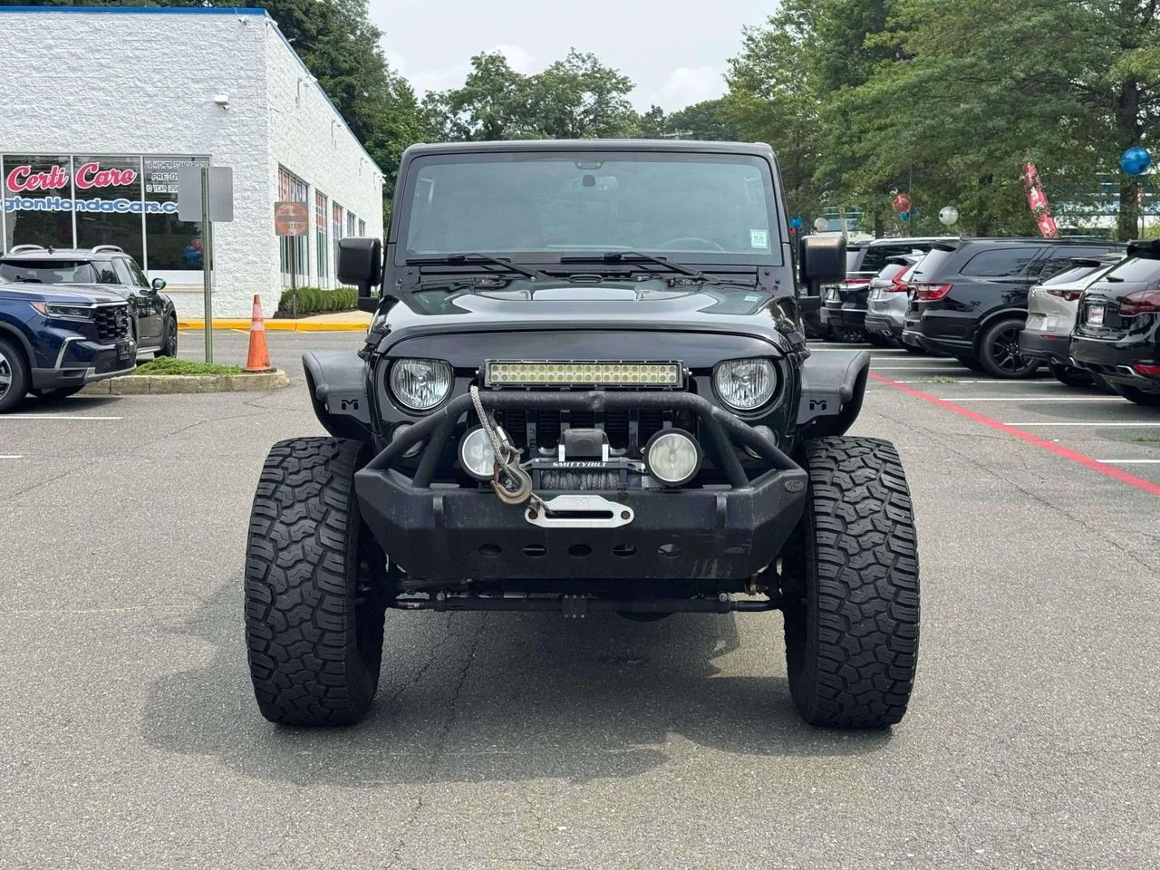 Used 2015 Black Clearcoat Jeep Sport image 2