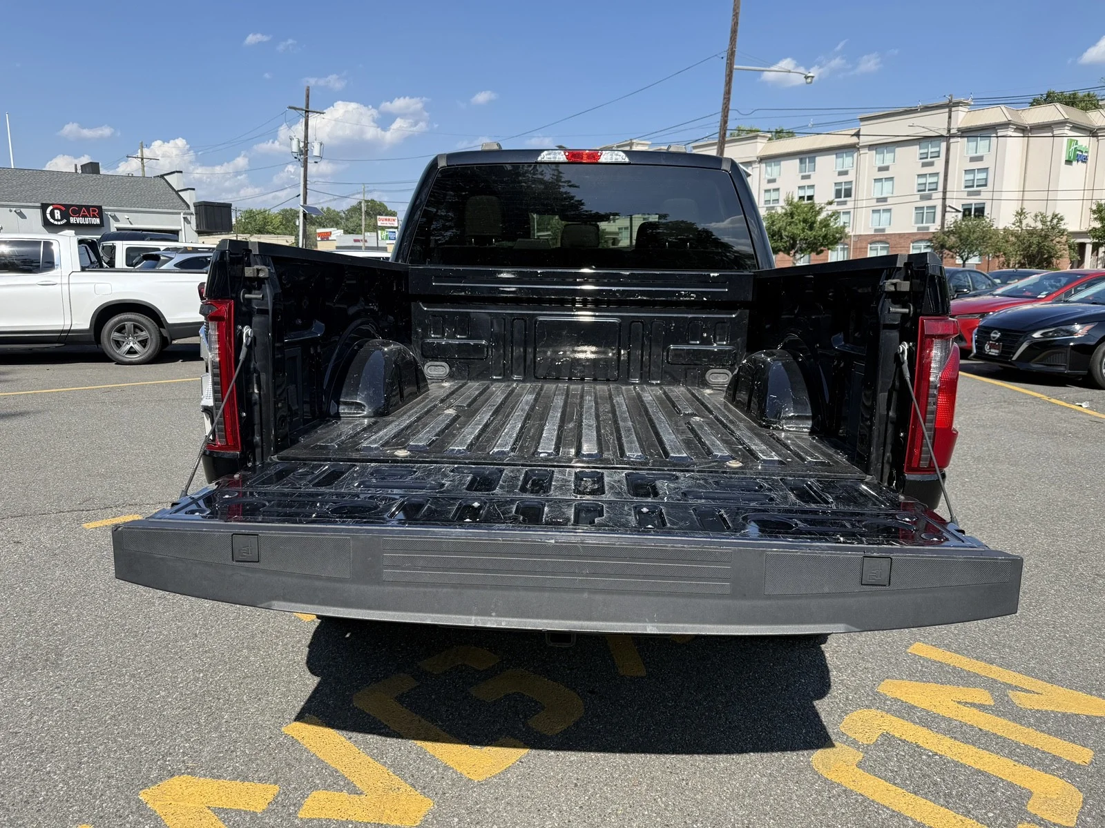 Used 2024 Agate Black Metallic Ford XLT 4WD image 4
