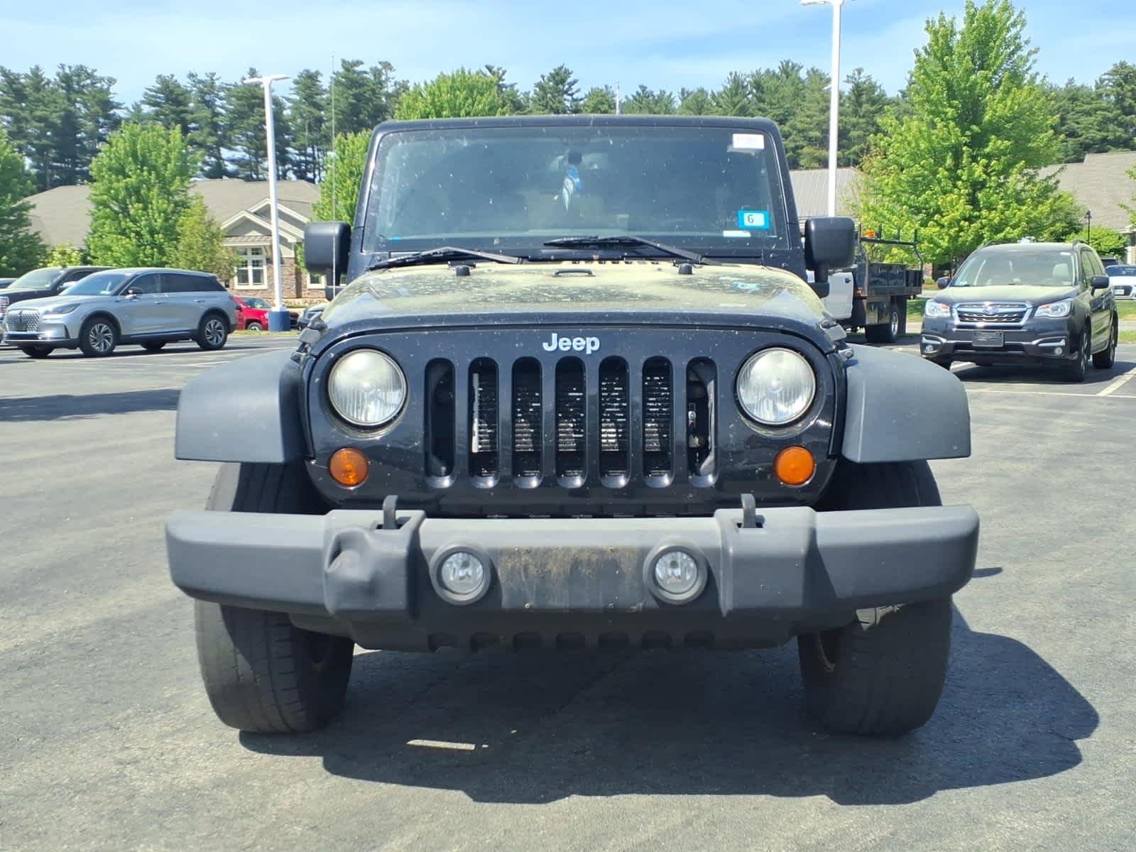 Used 2013 Black Clearcoat Jeep Sport image 2
