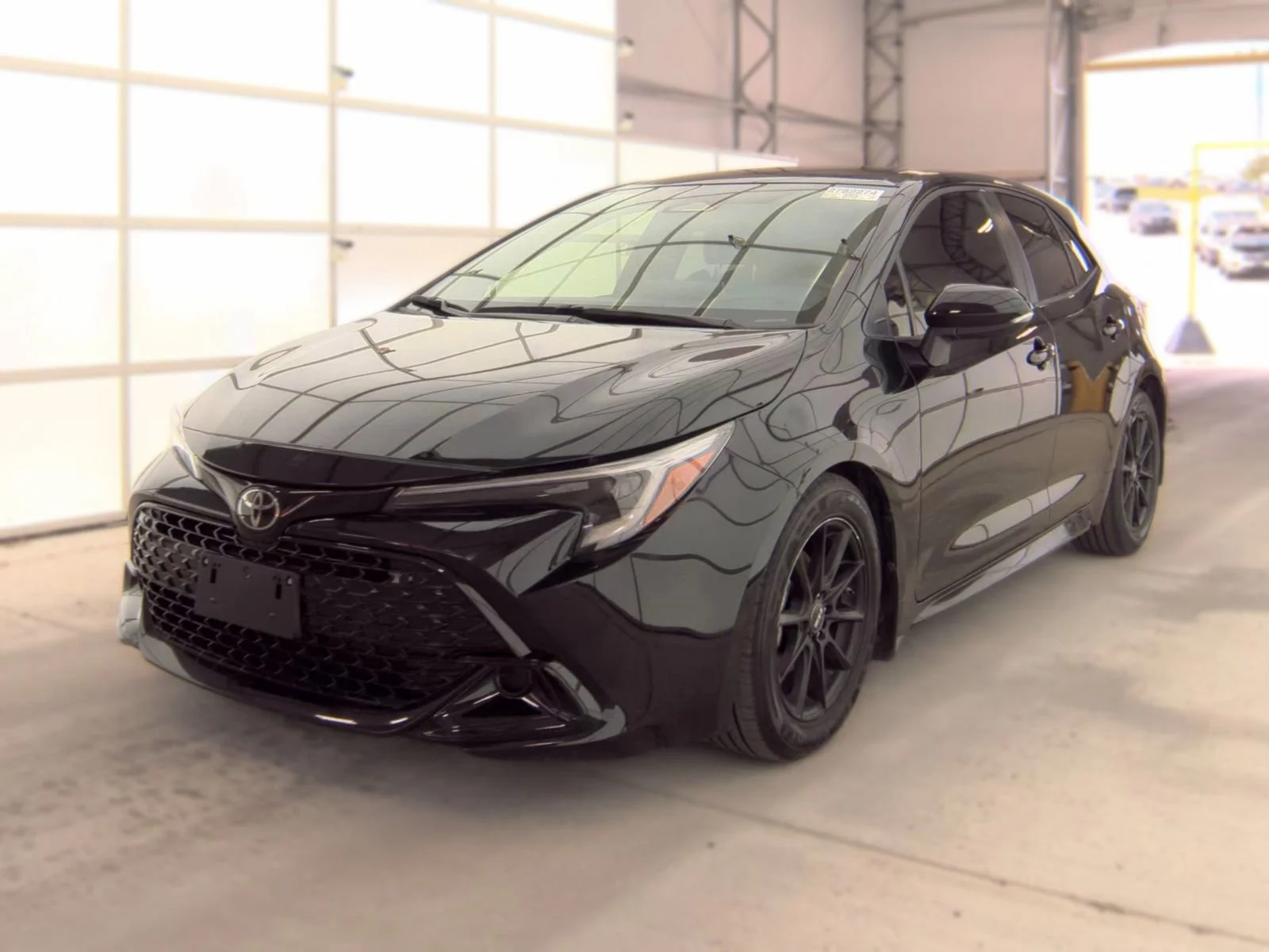 Used 2024 Midnight Black Metallic Toyota SE image 1