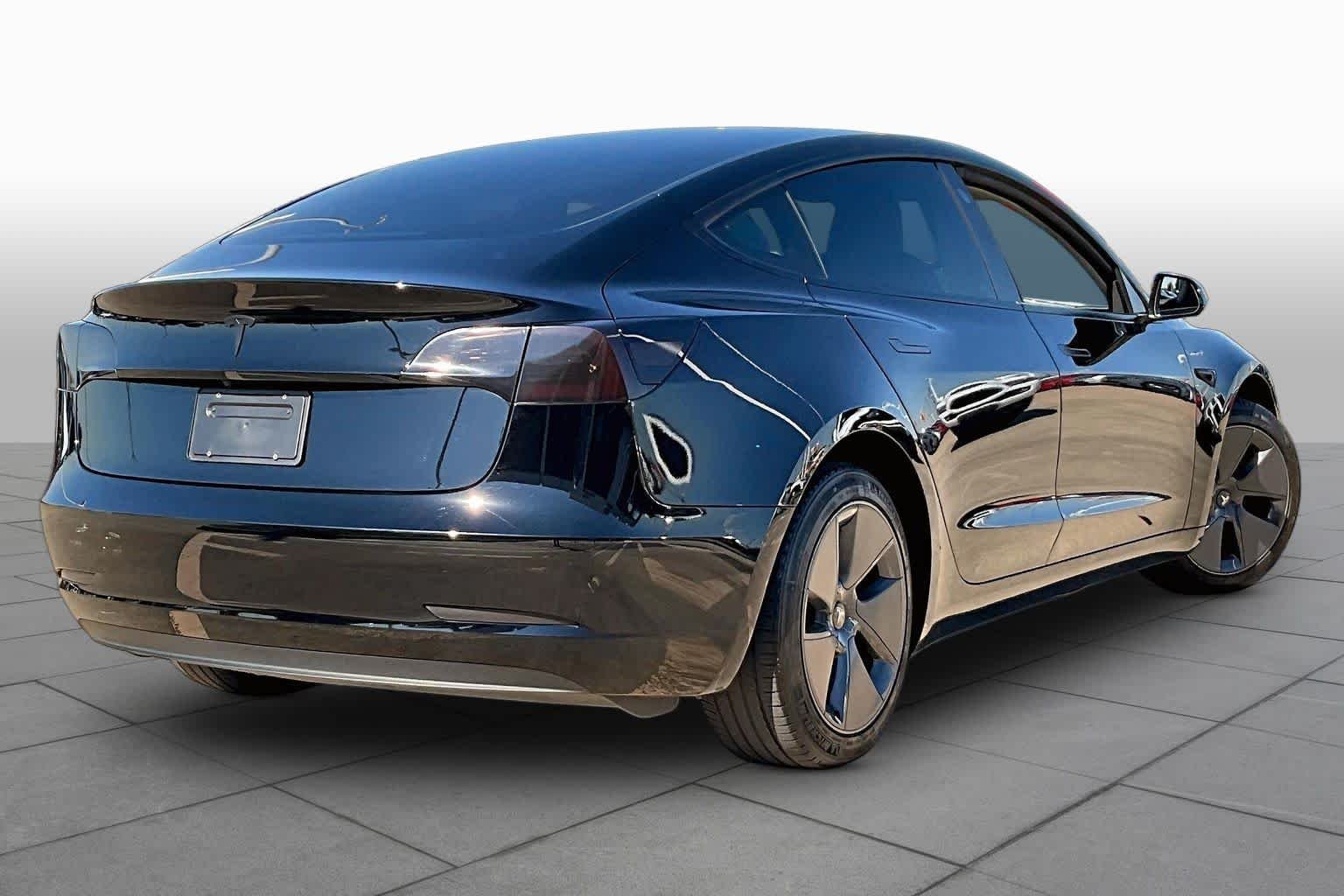 Used 2023 Solid Black Tesla  image 11