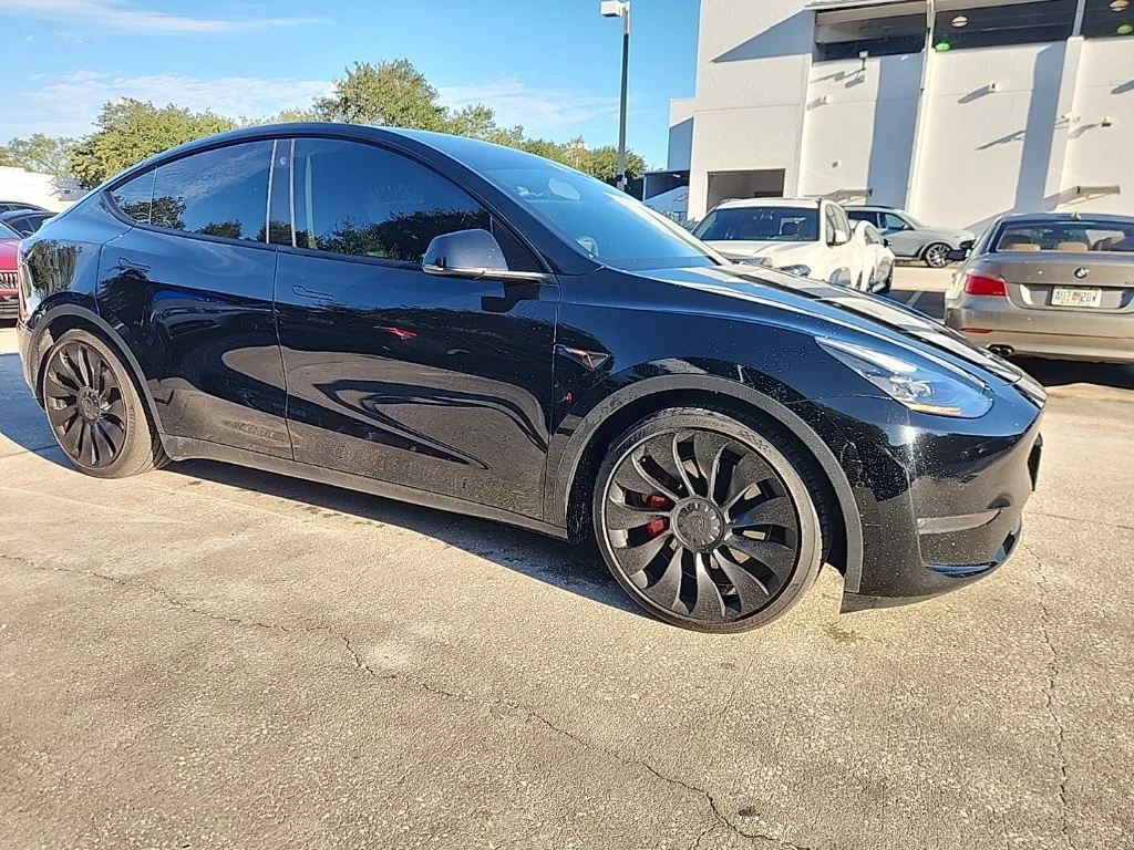 Used 2022 Solid Black Tesla Performance image 1