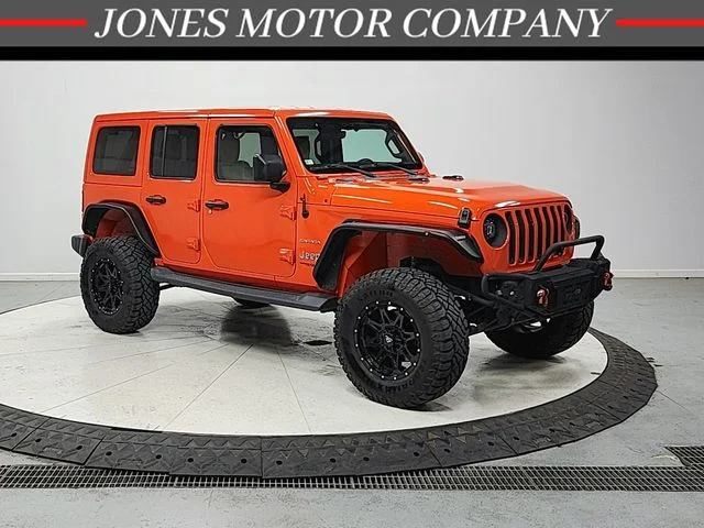 Used 2018 Orange Jeep Unlimited Sahara image 1
