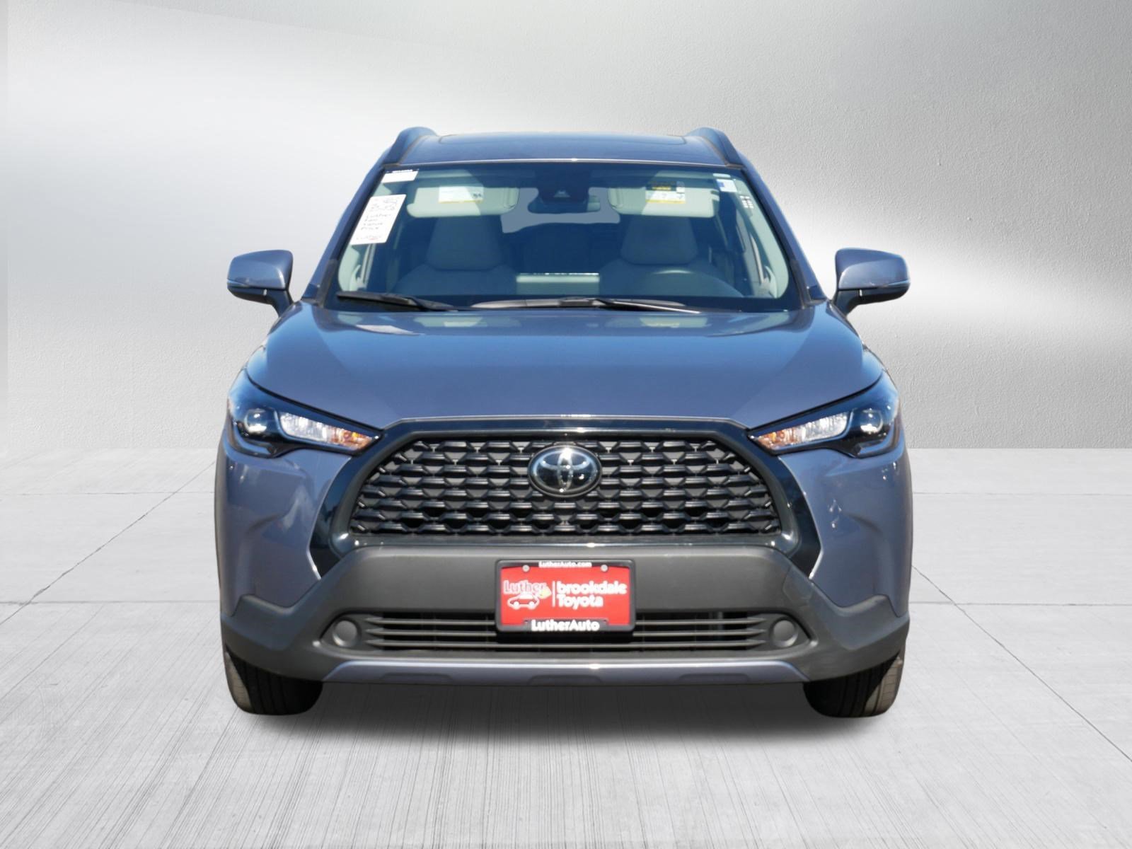 Certified 2022 Toyota Corolla Cross LE with VIN 7MUBAABG8NV043288 for sale in Brooklyn Center, Minnesota