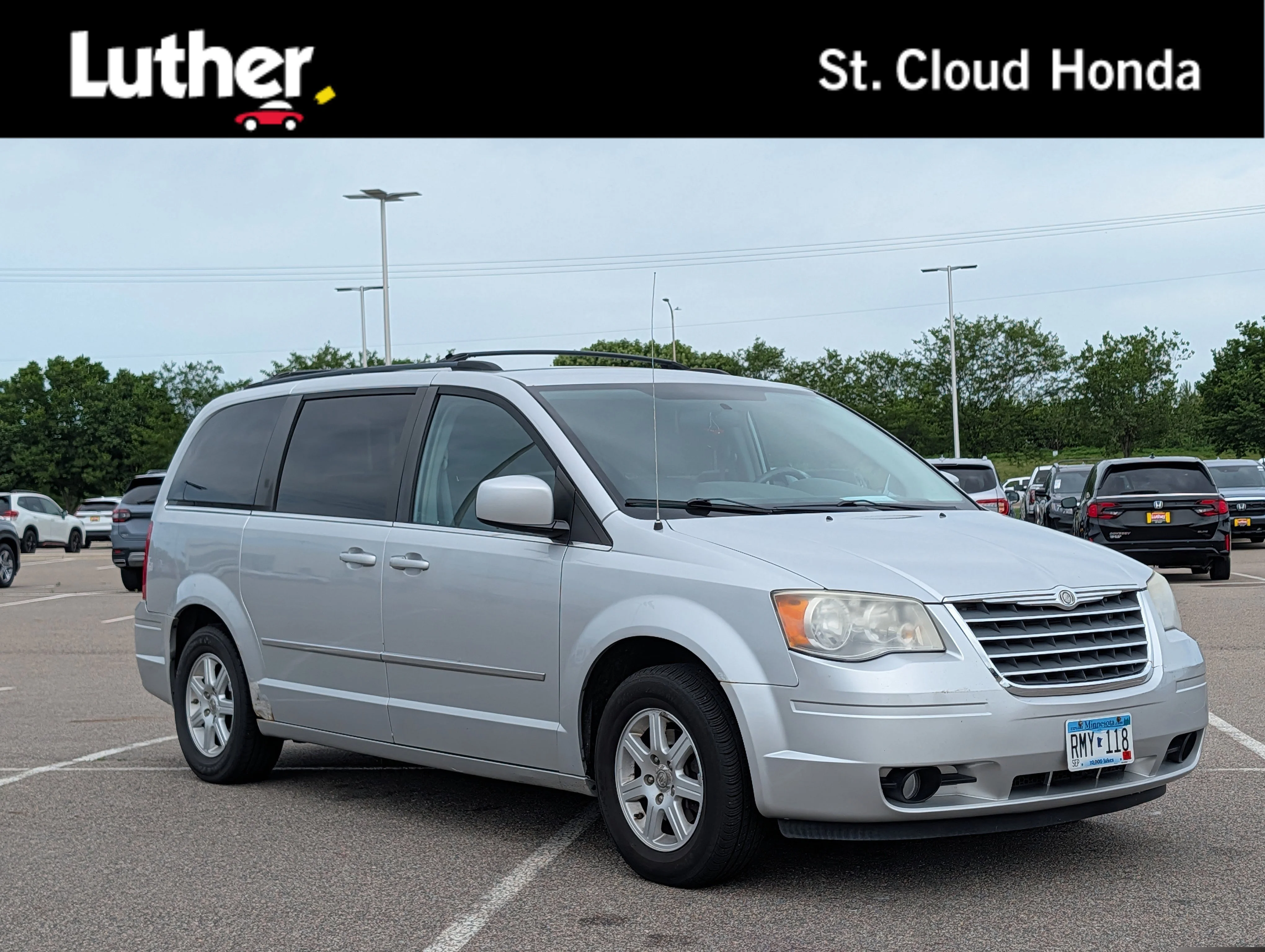 Used 2010 Bright Silver Metallic Chrysler Touring image 1