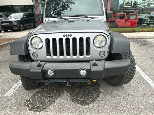Used 2014 Jeep Wrangler Unlimited Sport with VIN 1C4BJWDG9EL228116 for sale in Lutz, FL